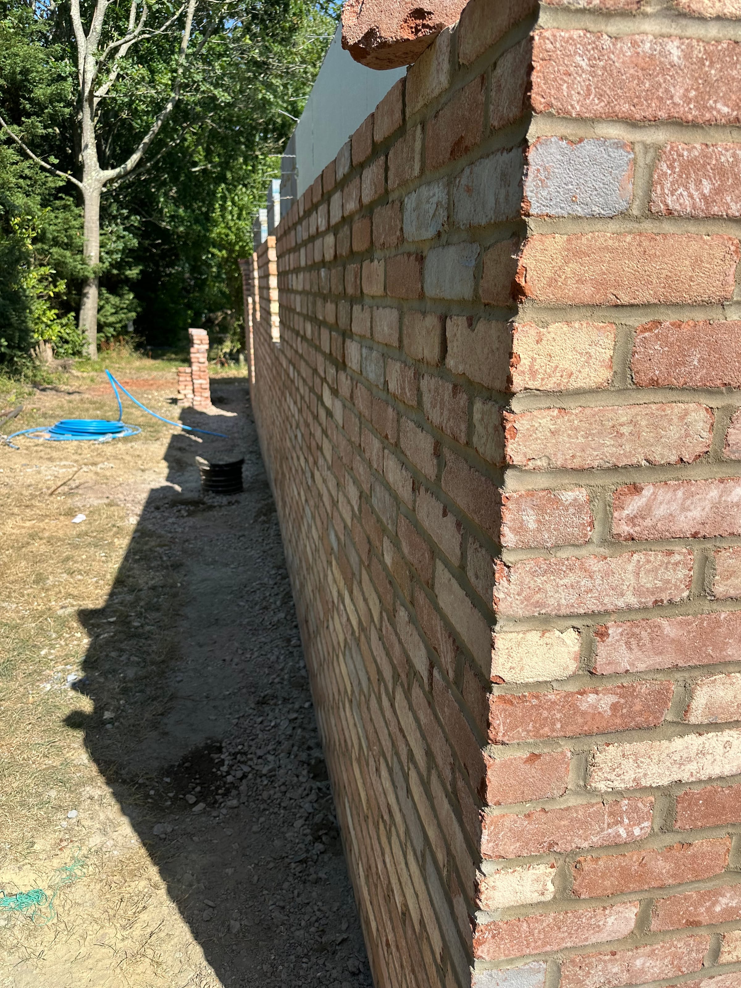 Brick corner wall rising from the foundation