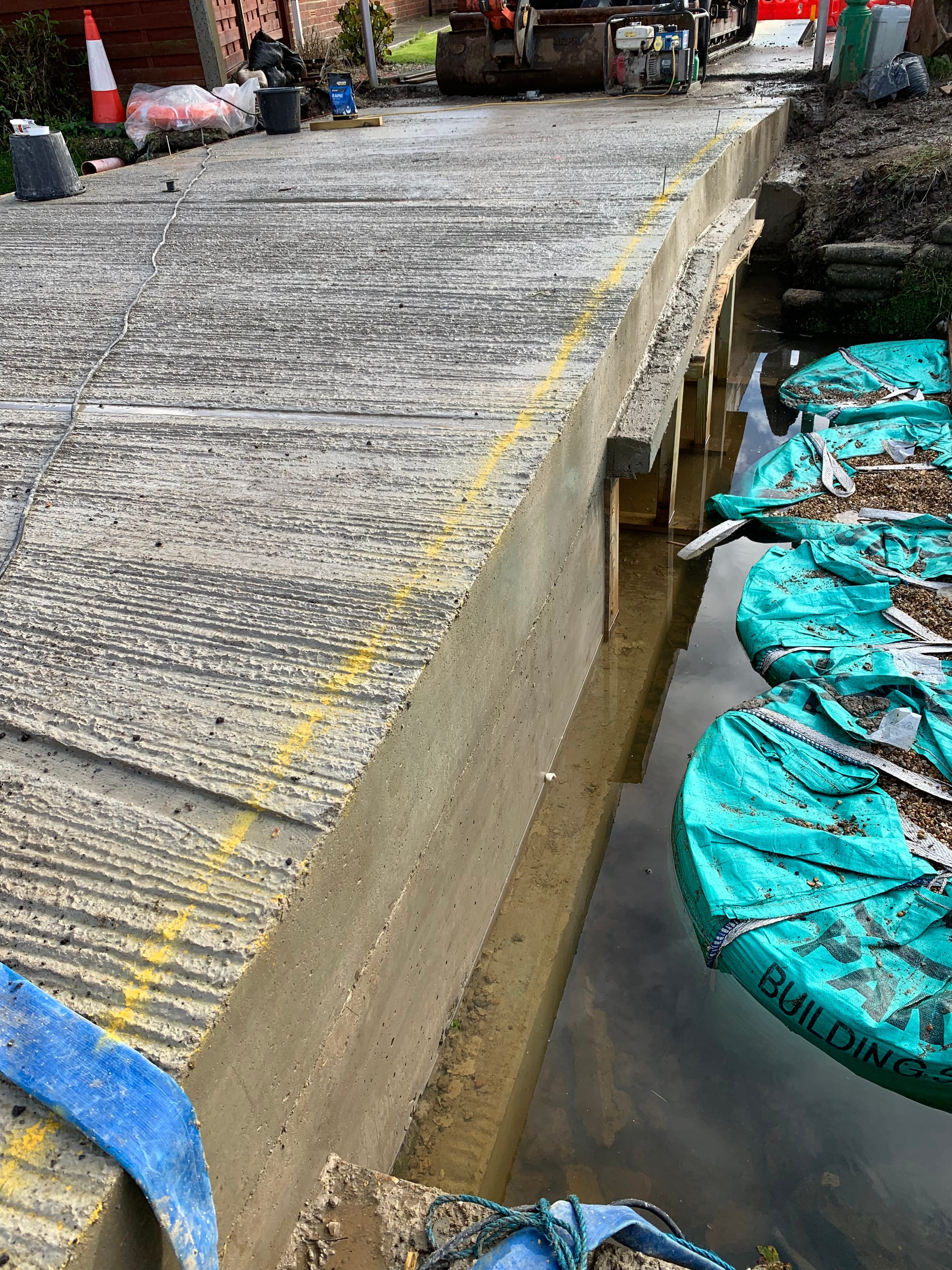 Concrete deck pour for a footbridge over a waterway