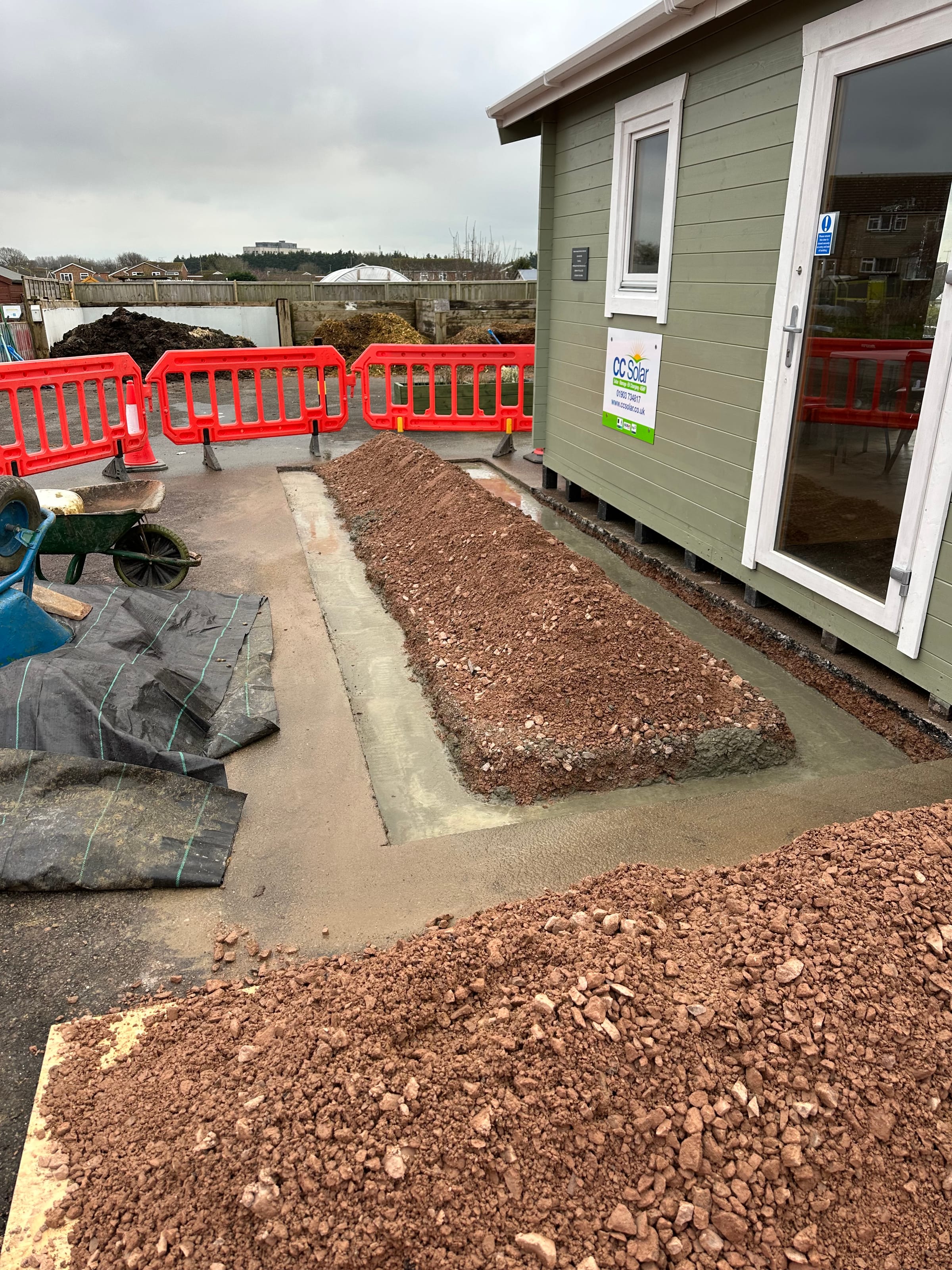 Concrete base being poured for a garden cabin