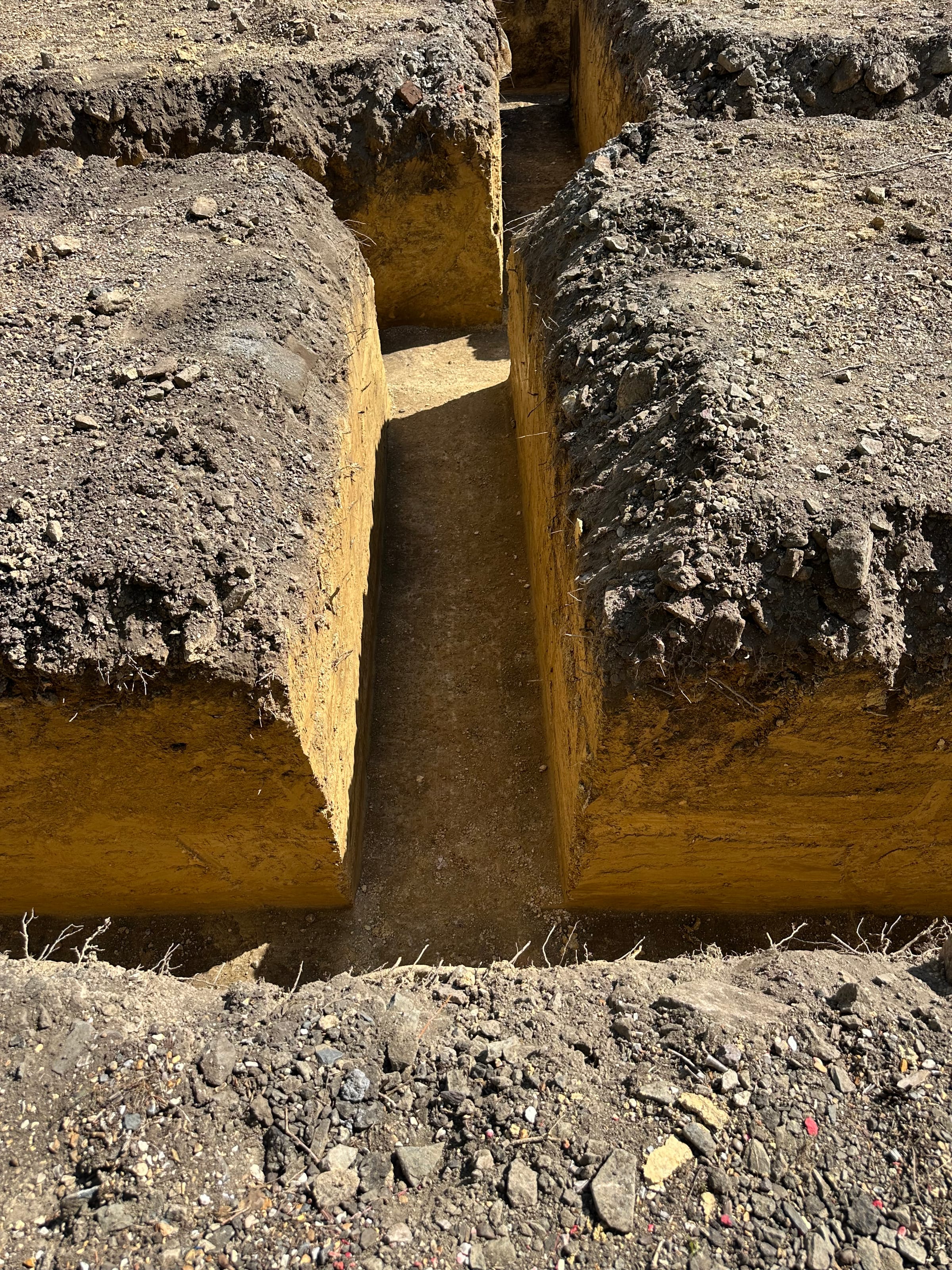 Close-up of excavated foundation trench footings