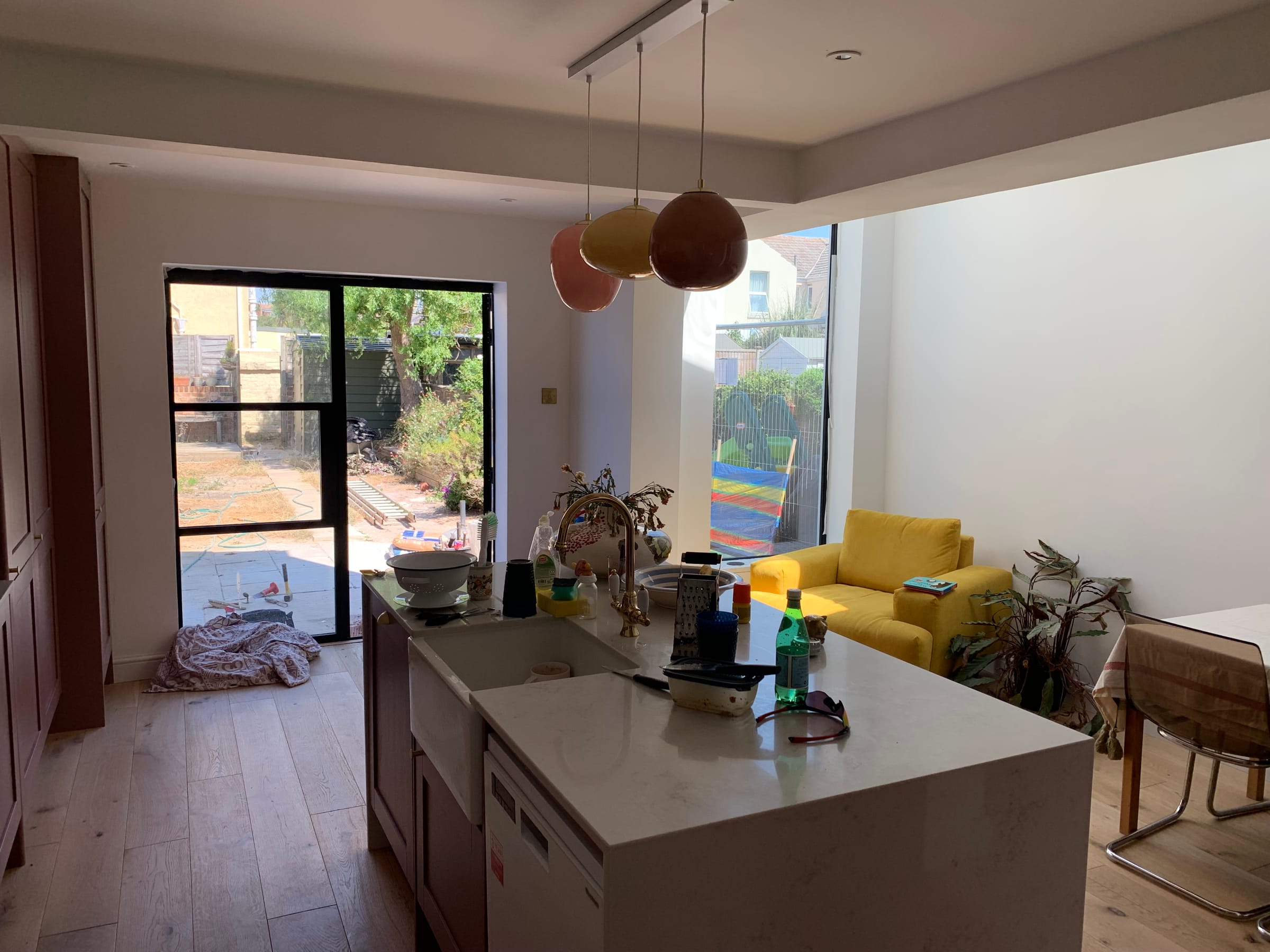 Open-plan kitchen extension with island and full-height glazing