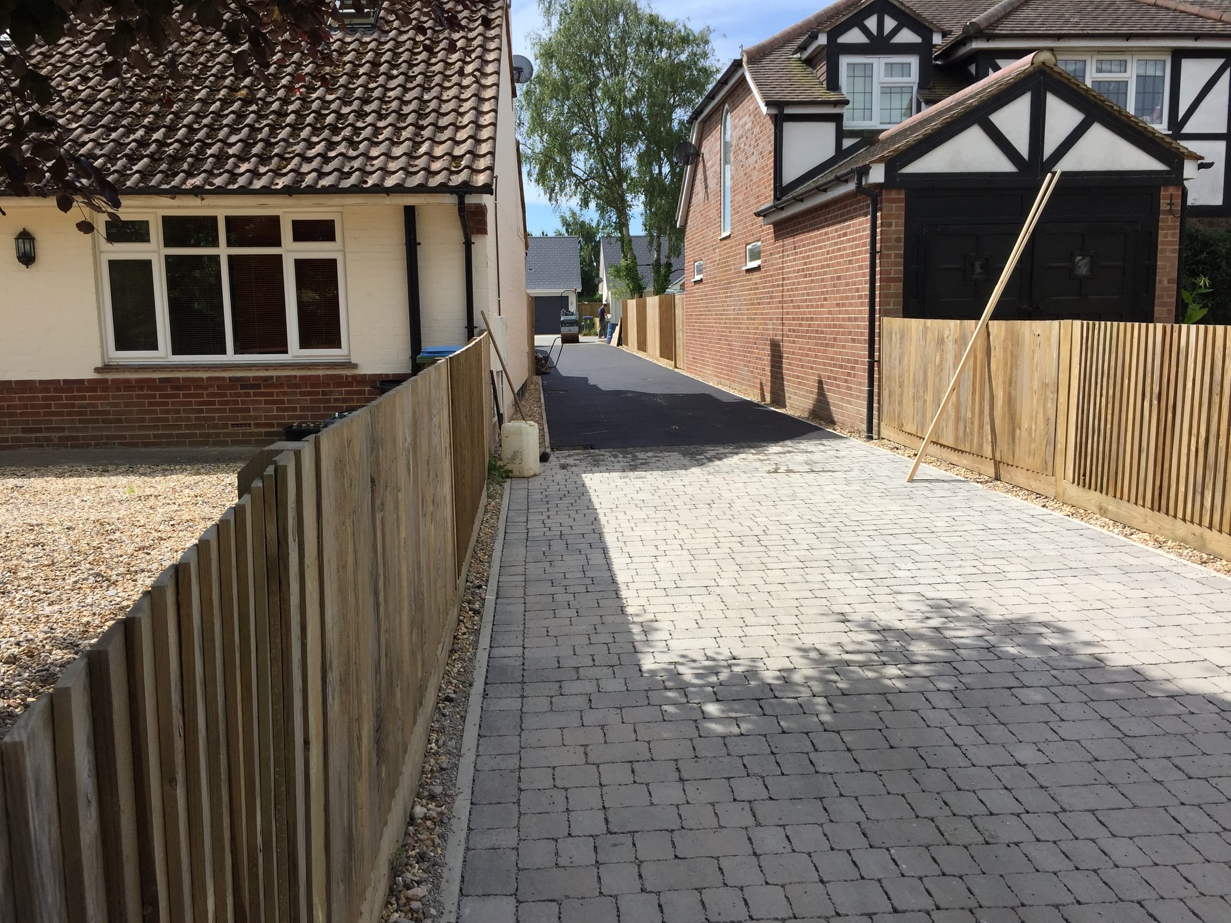 Block paved pathway between two houses