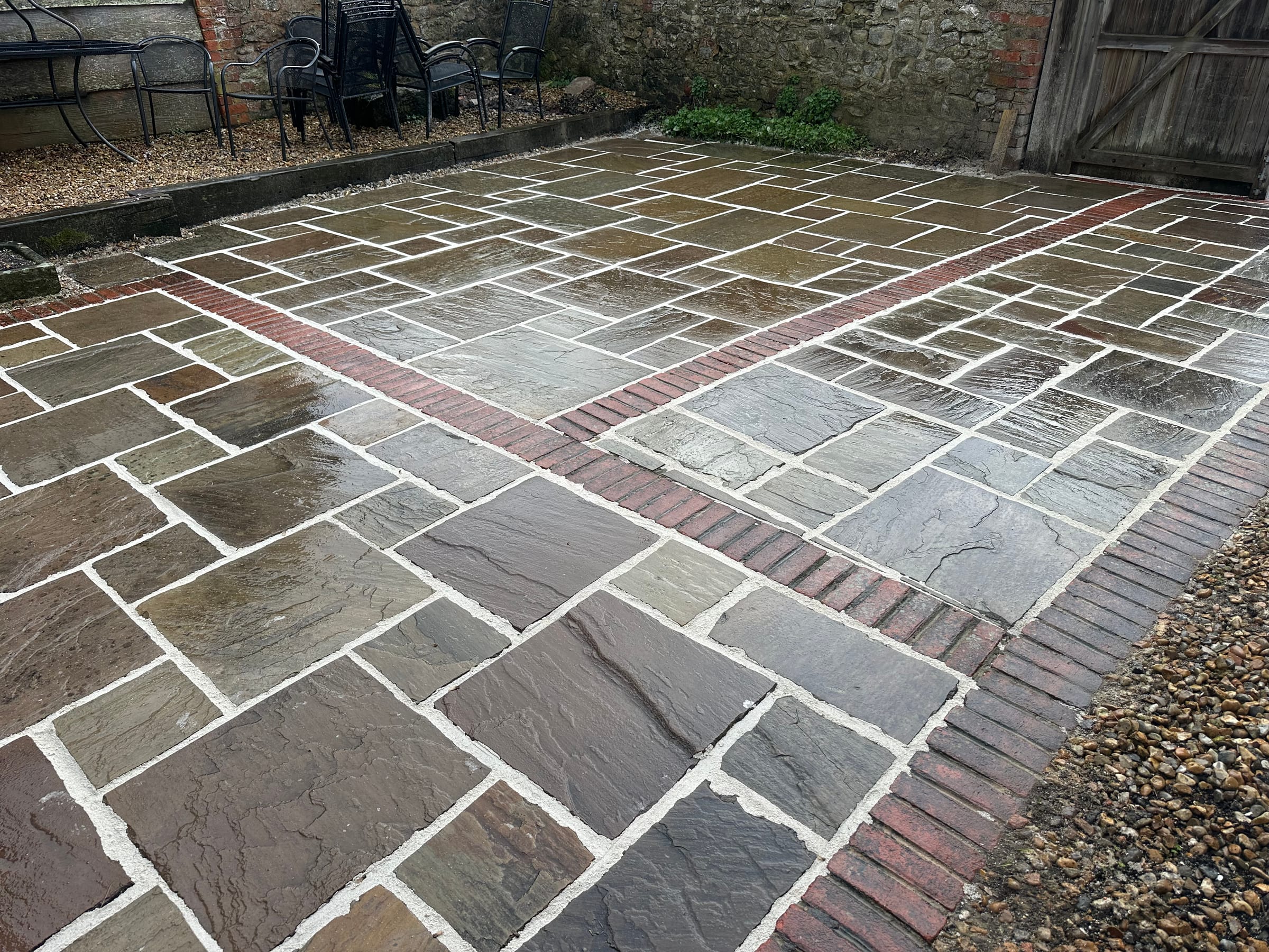 Indian stone patio with brick banding detail