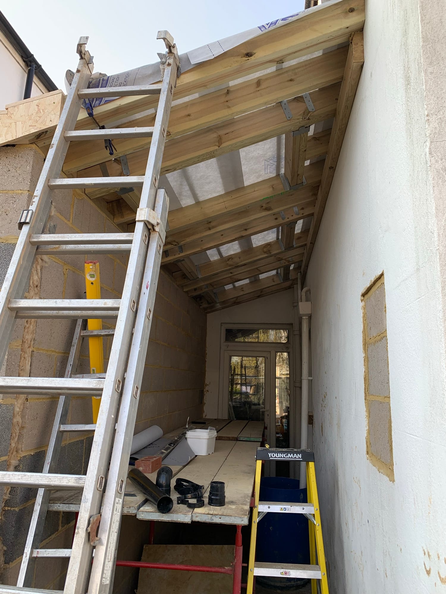 Timber roof framing under construction